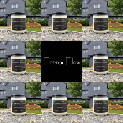 Fern x Flow Halloween Candle Collection, featuring eight Halloween-inspired vegan, soy candles all in front of the Salem Witch House in Salem, Massachusetts Sleepy Hollow, Witch's Woods, Spellbook, Haunted Harvest, Covenstead, Black Flame, Phantom Fire, and Ominous Apple.